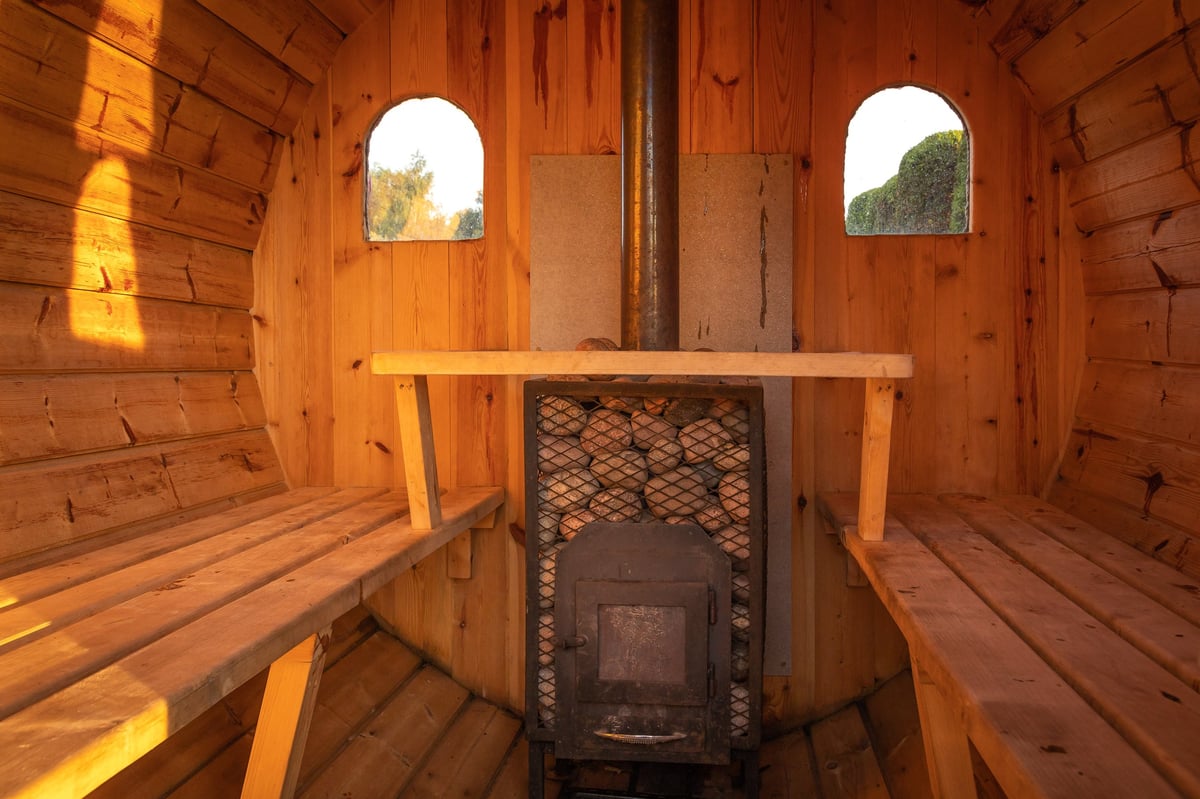 Traditional wooden sauna with a stone heater